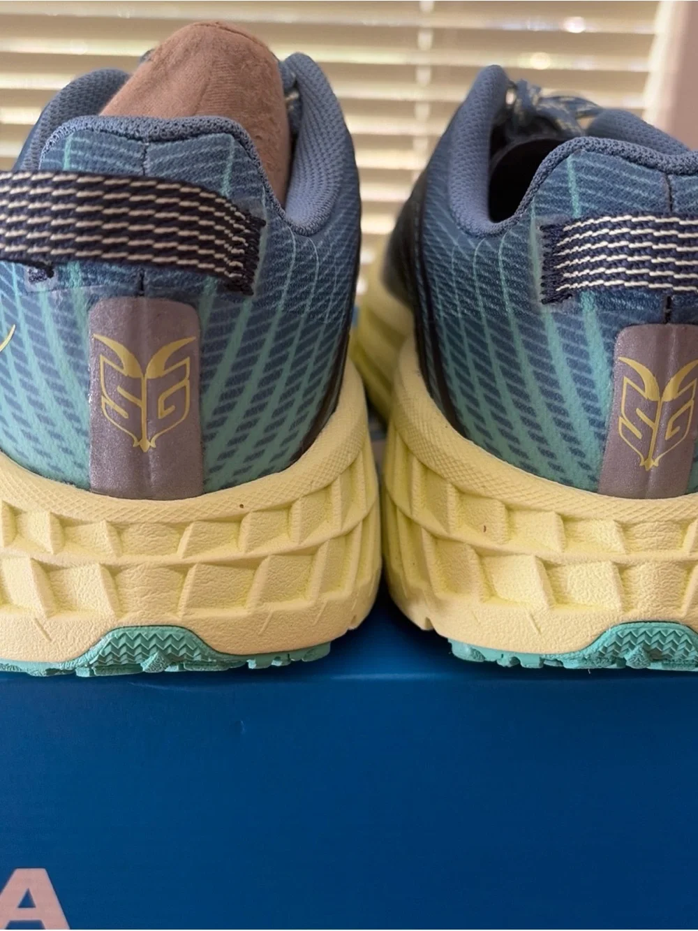Hoka One One Women's Blue and Pale Yellow Trail Runners